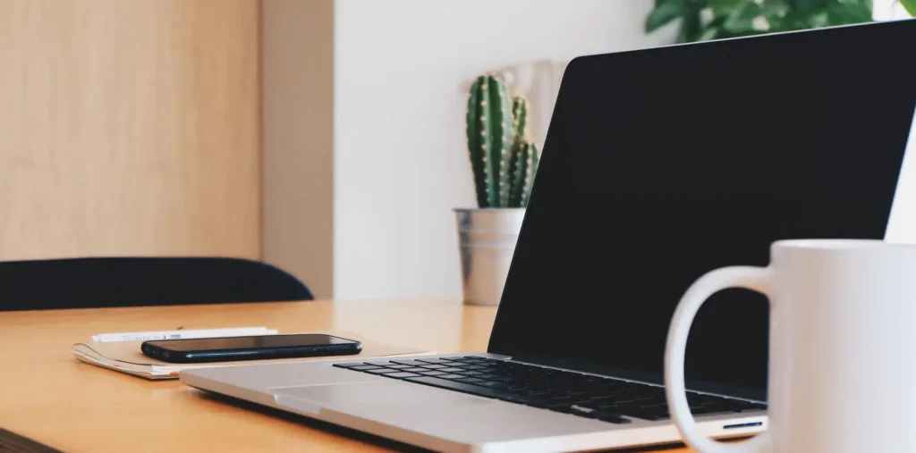 Velocity Digital Privacy Policy banner image of computer and cup on desk